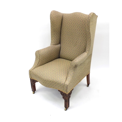 19 - Chippendale design mahogany framed wingback armchair with floral upholstery