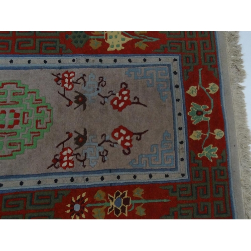 93 - Geometric patterned beige and red ground rug, approximately 175cm x 90cm