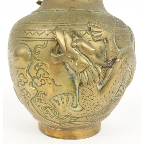 207 - Oriental bronze vase decorated in relief with dragons, 24cm high