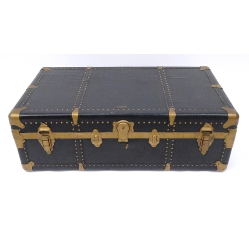 97 - Large Overland brass bound wooden trunk