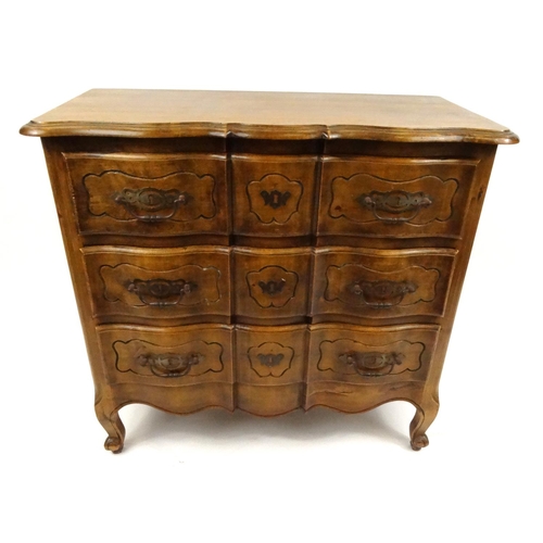 14 - Carved oak three drawer serpentine front chest, 85cm high x 90cm wide x 44cm deep