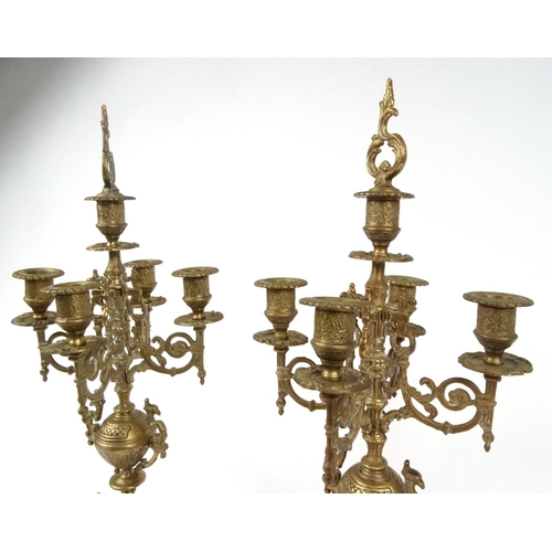 172 - Pair of ornate brass five branch candelabra, 52cm high