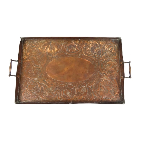 294 - Arts and Crafts rectangular copper tray with embossed floral decoration, 65cm long