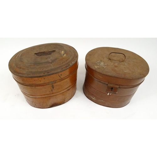 253 - Two vintage tin hat boxes with a vintage hat and leather belts