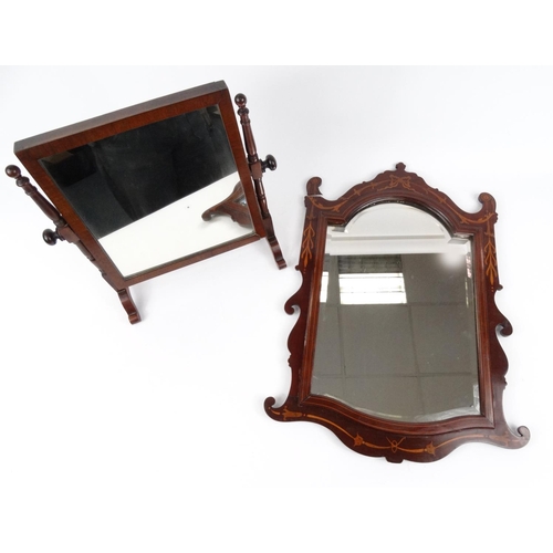 92 - Mahogany swing mirror and an inlaid mahogany bevel edged mirror
