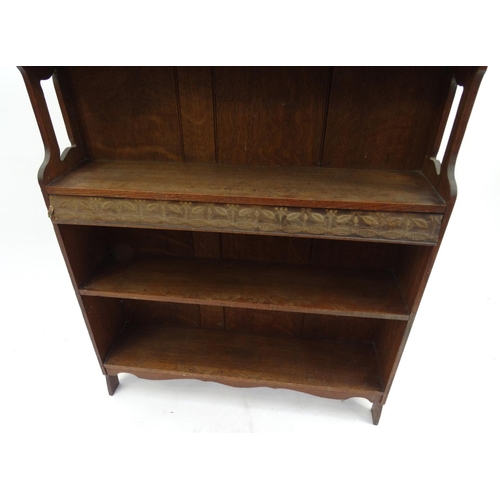 54 - Oak Liberty style Arts and Crafts open bookcase fitted with four shelves, 90cm high x 69cm wide x 18... 
