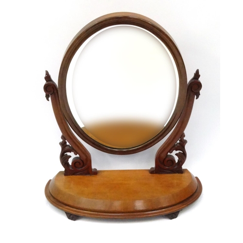 27 - Victorian mahogany toilet mirror with carved supports, 80cm high