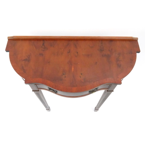 41 - Yew serpentine fronted hall table with a drawer, 75cm high x 84cm wide x 37cm deep