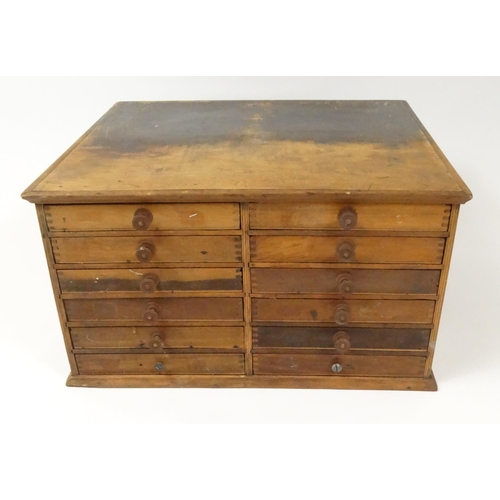 110 - Twelve drawer wooden tabletop chest, 31cm high x 56cm wide x 51cm deep