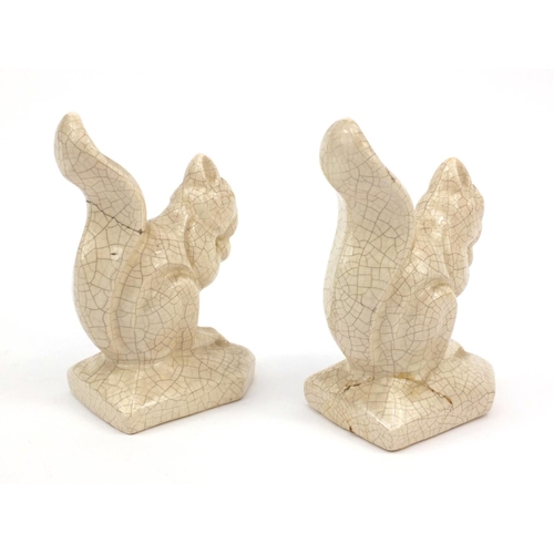 151 - L. Fontinelle - Pair of crackle glazed squirrels, 17cm high