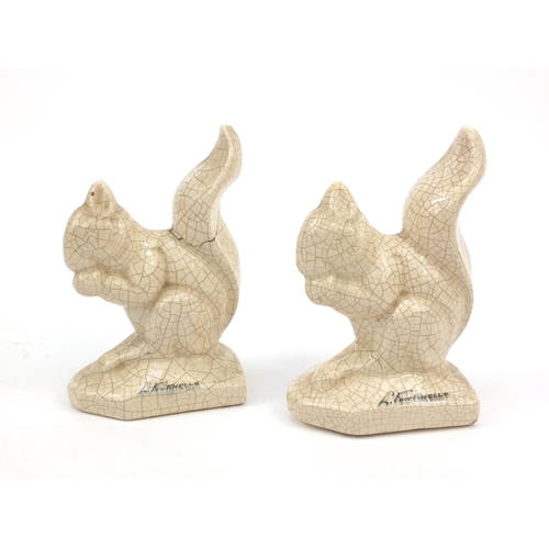 151 - L. Fontinelle - Pair of crackle glazed squirrels, 17cm high