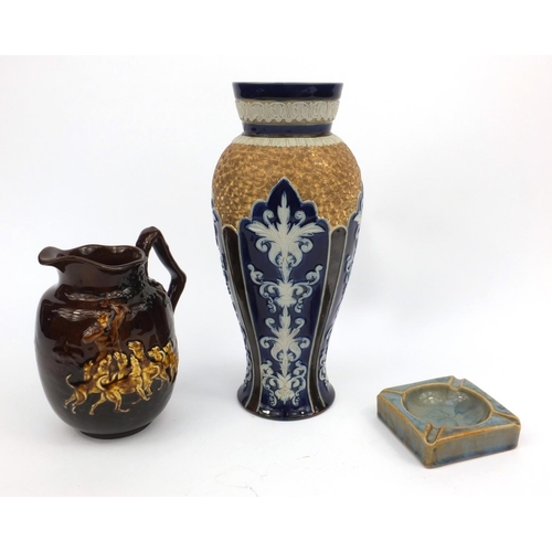 153 - Three Royal Doulton stoneware items comprising Art Nouveau vase, ashtray and a Kings ware jug decora... 