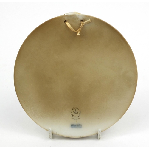 147 - Circular Royal Copenhagen Parian ware plaque decorated with a harvesting scene, 14cm diameter