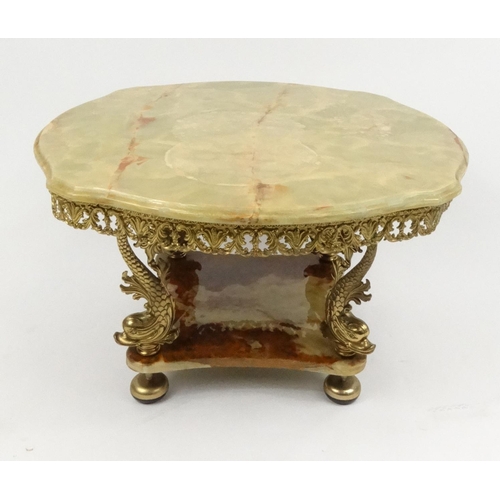 37 - Circular onyx and brass coffee table, 43cm high x 72cm diameter