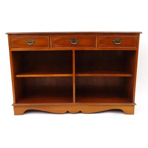 34 - Inlaid yew wood dwarf bookcase fitted with three drawers above open shelves, 80cm high x 121cm wide ... 