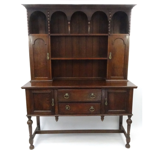 20 - Oak dresser with an arrangement of shelves and cupboards, 197cm high x 152cm wide x 56cm deep