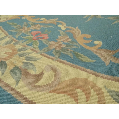 44 - Large oval cream and blue ground floral rug, approximatelky 260cm x 160cm