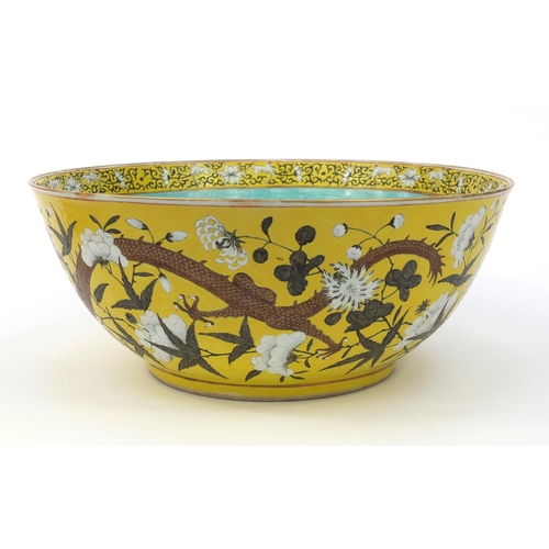 560 - Large oriental Chinese porcelain punch bowl hand painted with dragons and flowers, character mark to... 