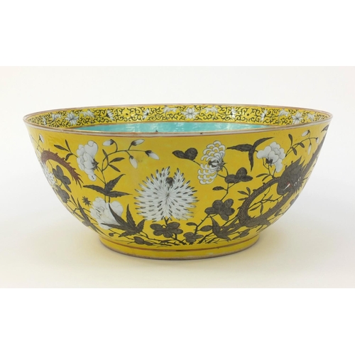 560 - Large oriental Chinese porcelain punch bowl hand painted with dragons and flowers, character mark to... 