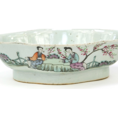 566 - Two oriental Chinese porcelain shaped dishes hand painted with maidens and script to back, the large... 