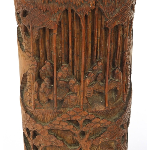 652 - Pair of wooden oriental Chinese bamboo brush pots carved with figures and landscape, 26cm high