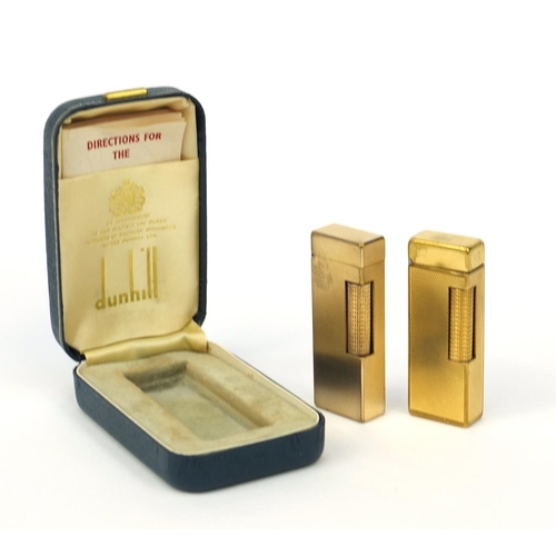 122 - Boxed gold plated Dunhill lighter with engine turned decoration, together with an unboxed example, b... 