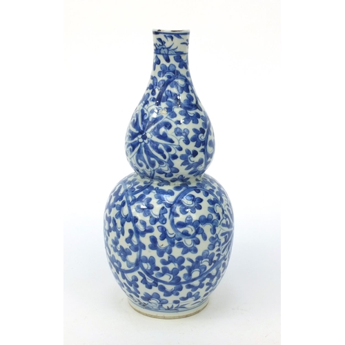 548 - Oriental Chinese porcelain blue and white double gourd vase hand painted with flowers, character mar... 