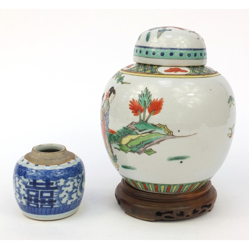 582 - Oriental Chinese porcelain ginger jar and cover hand painted with figures, mounted on a wooden stand... 