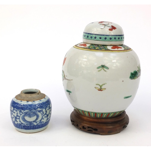 582 - Oriental Chinese porcelain ginger jar and cover hand painted with figures, mounted on a wooden stand... 