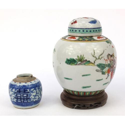 582 - Oriental Chinese porcelain ginger jar and cover hand painted with figures, mounted on a wooden stand... 