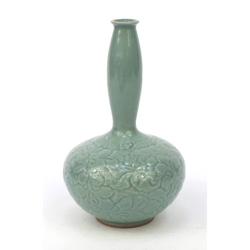 584 - Oriental Chinese pottery vase embossed with flowers, character marks to base, 21cm high