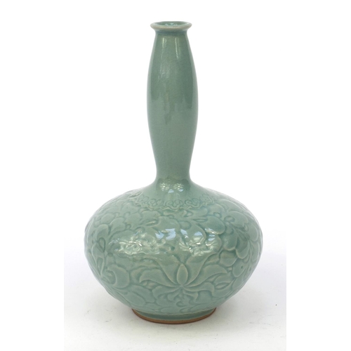 584 - Oriental Chinese pottery vase embossed with flowers, character marks to base, 21cm high