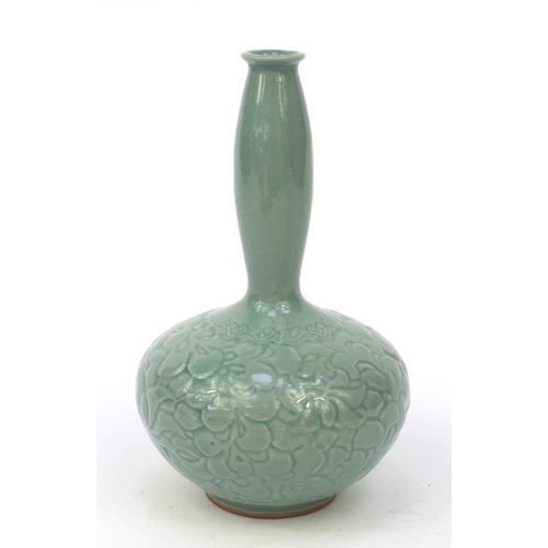 584 - Oriental Chinese pottery vase embossed with flowers, character marks to base, 21cm high