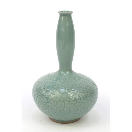 584 - Oriental Chinese pottery vase embossed with flowers, character marks to base, 21cm high