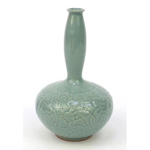 584 - Oriental Chinese pottery vase embossed with flowers, character marks to base, 21cm high