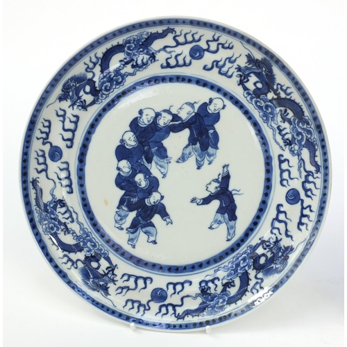 543 - Oriental Chinese porcelain plate hand painted with acrobats and dragons, together with a similar pla... 