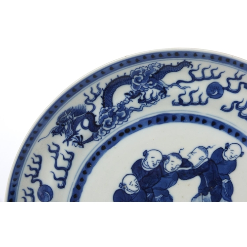 543 - Oriental Chinese porcelain plate hand painted with acrobats and dragons, together with a similar pla... 