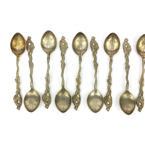 647 - Set of 12 oriental Chinese white metal teaspoons with dragon terminals, stamped 'Shanghai 900' to th... 