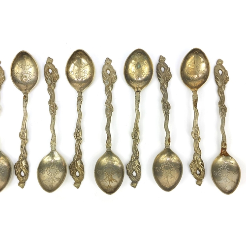 647 - Set of 12 oriental Chinese white metal teaspoons with dragon terminals, stamped 'Shanghai 900' to th... 