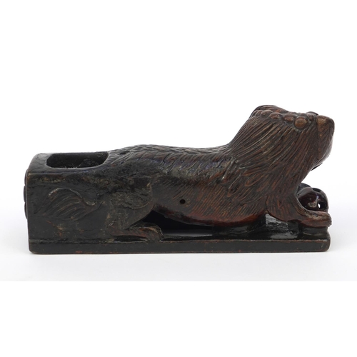 659 - Oriental Chinese wooden scribe's arm rest modelled as a dog of Foo, 20cm diameter