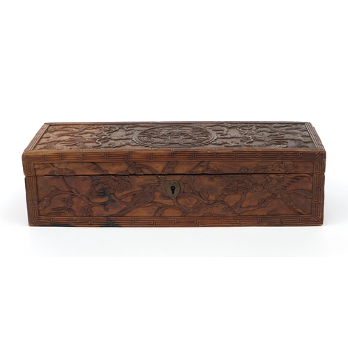 657 - Oriental Chinese hardwood box carved with dragons and flowers, 30cm wide