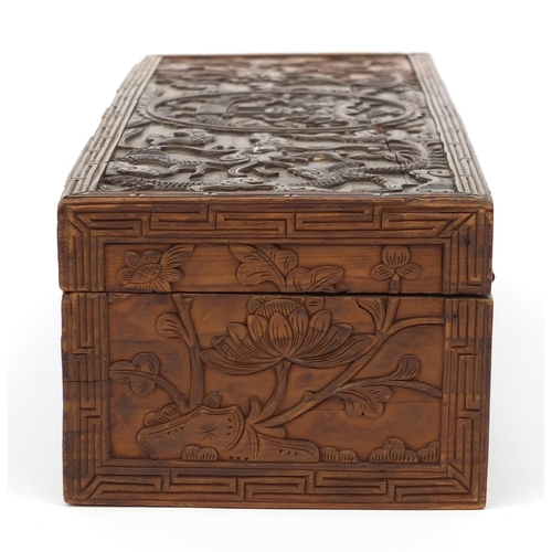 657 - Oriental Chinese hardwood box carved with dragons and flowers, 30cm wide