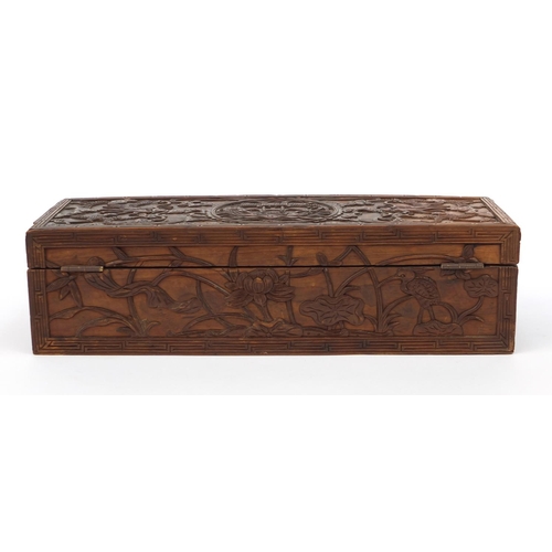 657 - Oriental Chinese hardwood box carved with dragons and flowers, 30cm wide