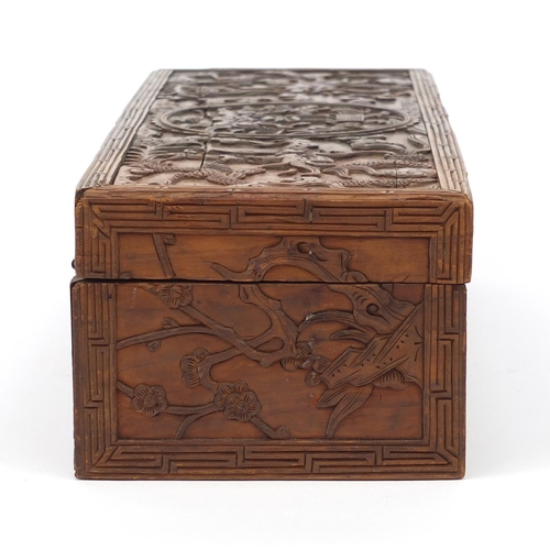 657 - Oriental Chinese hardwood box carved with dragons and flowers, 30cm wide