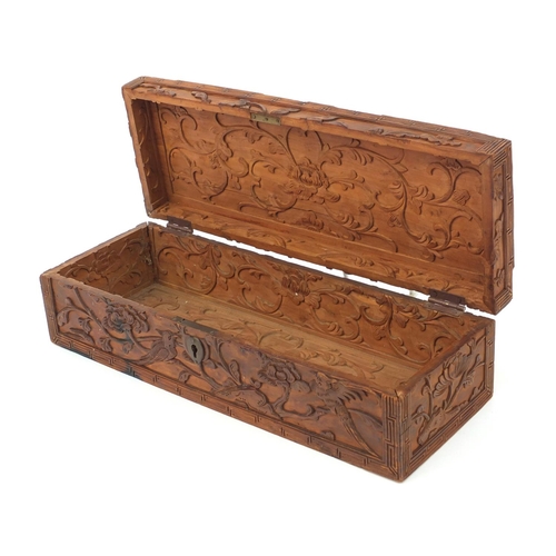 657 - Oriental Chinese hardwood box carved with dragons and flowers, 30cm wide