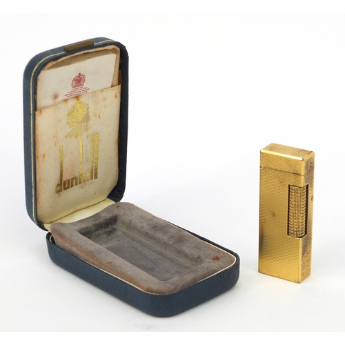 124 - Boxed gold plated Dunhill lighter with engine turned decoration, 6.5cm high