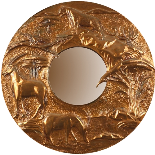 52 - Circular coppered convex mirror, the frame embossed with wild animals, 59cm diameter overall