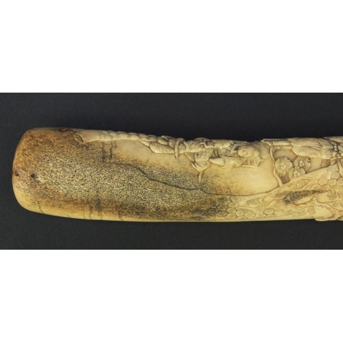 623 - Oriental carved bone dagger profusely carved with robed figures climbing a tree, 27.5cm long