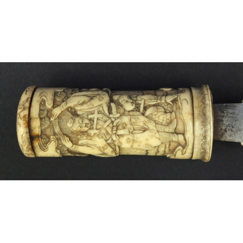 623 - Oriental carved bone dagger profusely carved with robed figures climbing a tree, 27.5cm long