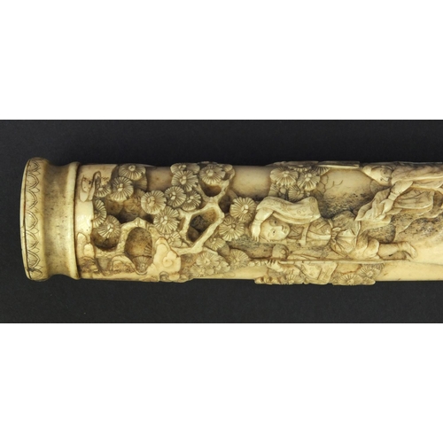 623 - Oriental carved bone dagger profusely carved with robed figures climbing a tree, 27.5cm long